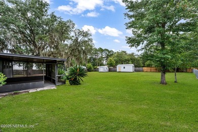 Set on 1.32 cleared, unrestricted acres in the highly - photo 33