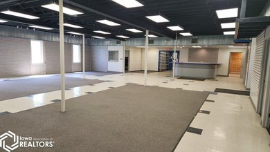 Former equipment dealership building on 1.27 acres at the west