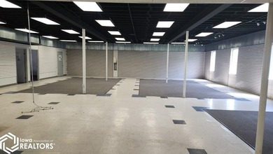 Former equipment dealership building on 1.27 acres at the west