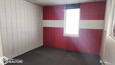 Former equipment dealership building on 1.27 acres at the west