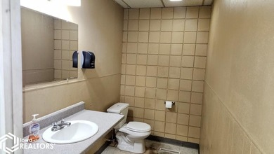 Former equipment dealership building on 1.27 acres at the west