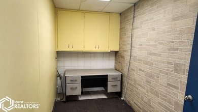 Former equipment dealership building on 1.27 acres at the west