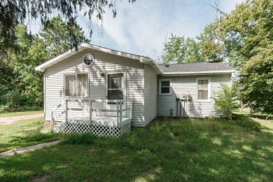 Welcome home! This charming home boasts a roomy living area with - Lake Home For Sale in Nekoosa, Wisconsin