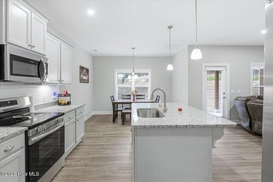 Welcome home! This well-kept two-story home features a bright