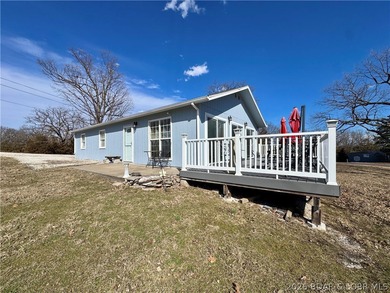 Stop dreaming about summer at the Lake of the Ozarks... start - Lake Home Active Under Contract in Gravois Mills, Missouri