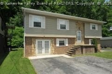 4- bedroom 2 bath mid-entry home with ground level entries front - photo 1