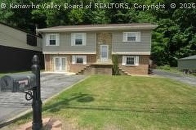 4- bedroom 2 bath mid-entry home with ground level entries front - photo 3