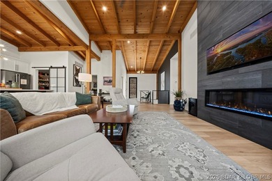 Contemporary luxury meets effortless lake living in this - photo 11