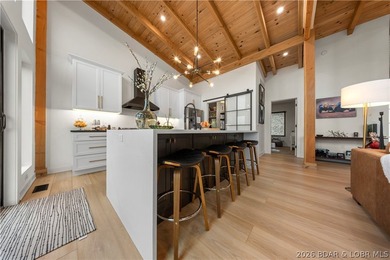 Contemporary luxury meets effortless lake living in this - photo 13