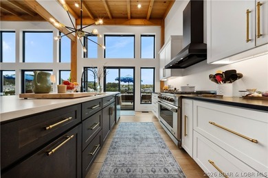 Contemporary luxury meets effortless lake living in this - photo 15