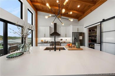 Contemporary luxury meets effortless lake living in this - photo 17