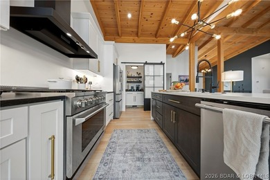 Contemporary luxury meets effortless lake living in this - photo 18