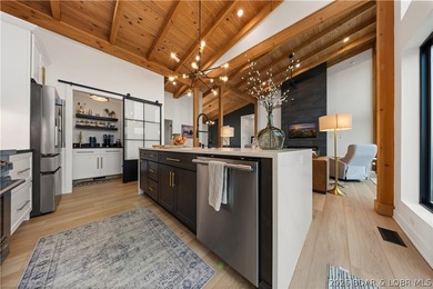 Contemporary luxury meets effortless lake living in this - photo 20