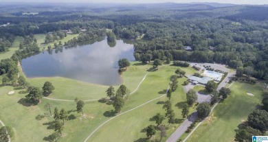 Wooded lot on 18 hole golf course community across the street