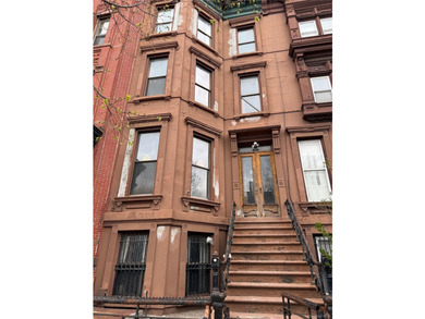 This classic four-story brownstone with beautiful architectural - photo 1