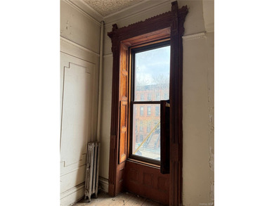 This classic four-story brownstone with beautiful architectural - photo 8