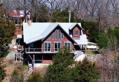 A VIEW FOR MILES! This one-of-a-kind custom log home showcases - photo 3