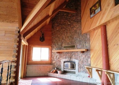 A VIEW FOR MILES! This one-of-a-kind custom log home showcases - photo 9