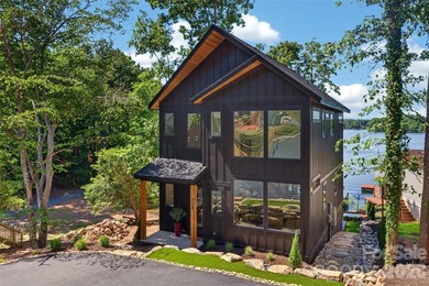 Experience refined lakefront living in this stunning new - photo 1
