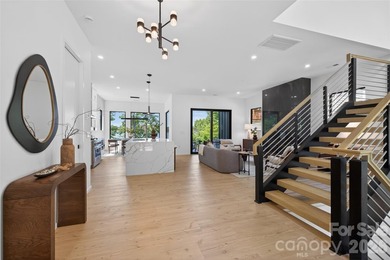 Experience refined lakefront living in this stunning new - photo 2