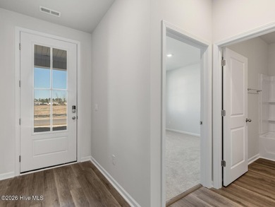 ''The Darby floor plan features an open-concept layout with a - photo 3