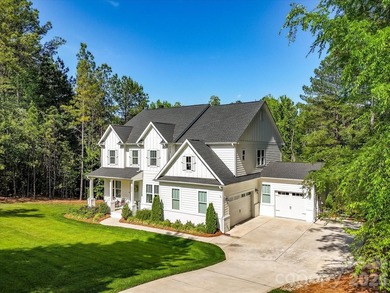 Nestled on a private, wooded lot in desirable Falls Cove near - photo 2