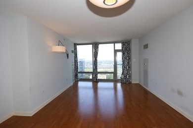 Perched on the 24th floor of sought-after 1400 Museum Park, this - photo 7