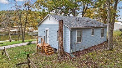 Tucked away in a quiet lakeside subdivision, this charming - photo 2