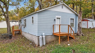 Tucked away in a quiet lakeside subdivision, this charming - photo 3