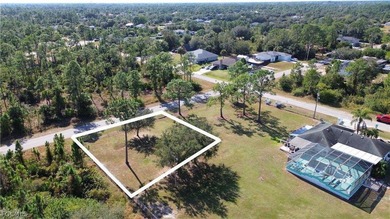 Cleared 0.25-acre residential lot located in Lehigh Acres. The - photo 2