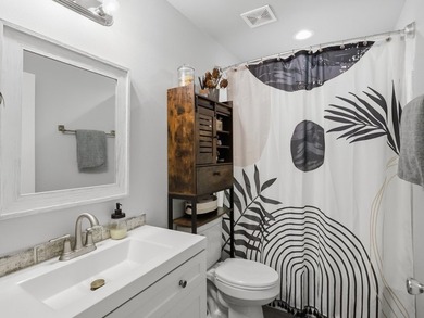 Built in 2021, this 3-bedroom, 2-bath coastal cottage sits on - photo 14