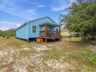 Built in 2021, this 3-bedroom, 2-bath coastal cottage sits on - photo 25