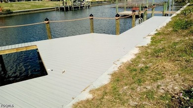 GULF ACCESS LOT WITH A NEWER SEAWALL, DOCK, CAPTAIN'S WALK, AND - photo 25