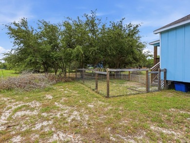 Built in 2021, this 3-bedroom, 2-bath coastal cottage sits on - photo 27