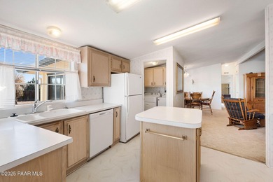 Set on a beautifully landscaped 0.8-acre lot in Paulden, AZ