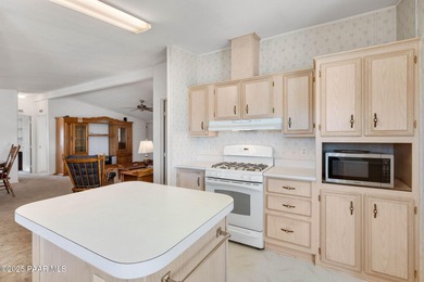 Set on a beautifully landscaped 0.8-acre lot in Paulden, AZ