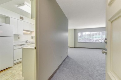 This is the one! Oak Hall Condominium Unit 106 is conveniently