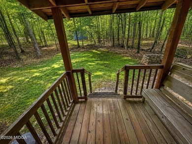 Tucked away on a private wooded setting just minutes from Lake - photo 2
