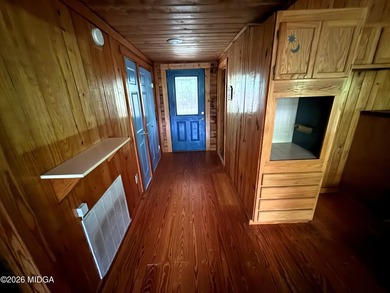 Tucked away on a private wooded setting just minutes from Lake - photo 3