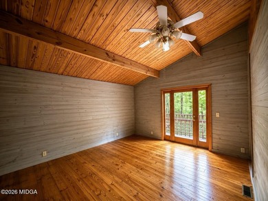 Tucked away on a private wooded setting just minutes from Lake - photo 7
