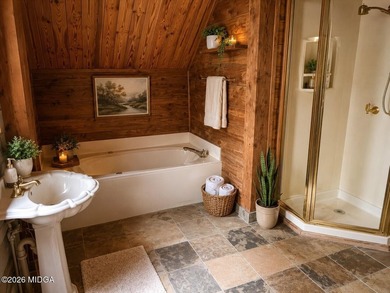 Tucked away on a private wooded setting just minutes from Lake - photo 8