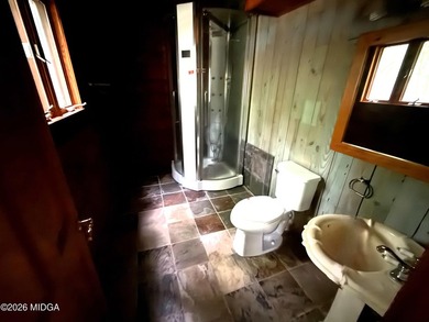 Tucked away on a private wooded setting just minutes from Lake - photo 10