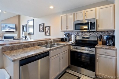 This beautifully updated condo sits high above the lake with - photo 9