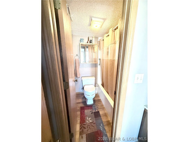 Step into easy lake living with a completely turn-key 2 bed, 2