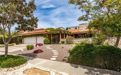 A gated courtyard entry sets the tone for this charming - photo 1