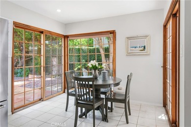 A gated courtyard entry sets the tone for this charming - photo 9