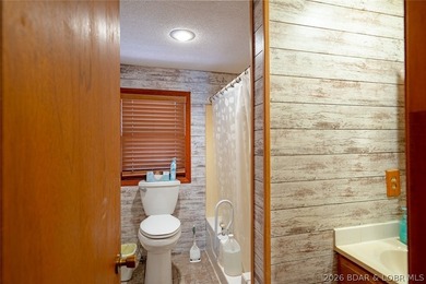 Lakefront home with Endless Potential! This 3-bedroom, 2-bath - photo 12