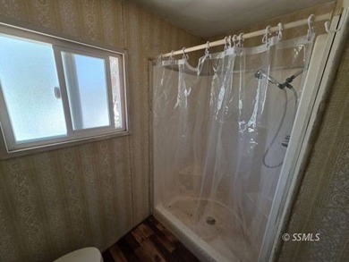 Perched on the high point of the parcel, this manufactured home - photo 12