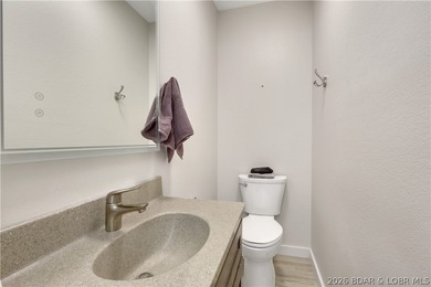 This 3-bedroom, 2-bath home on Nonsuch in Lake Ozark is now - photo 14