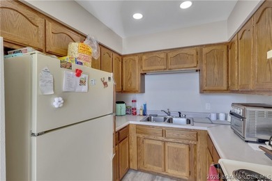 This 3-bedroom, 2-bath home on Nonsuch in Lake Ozark is now - photo 15